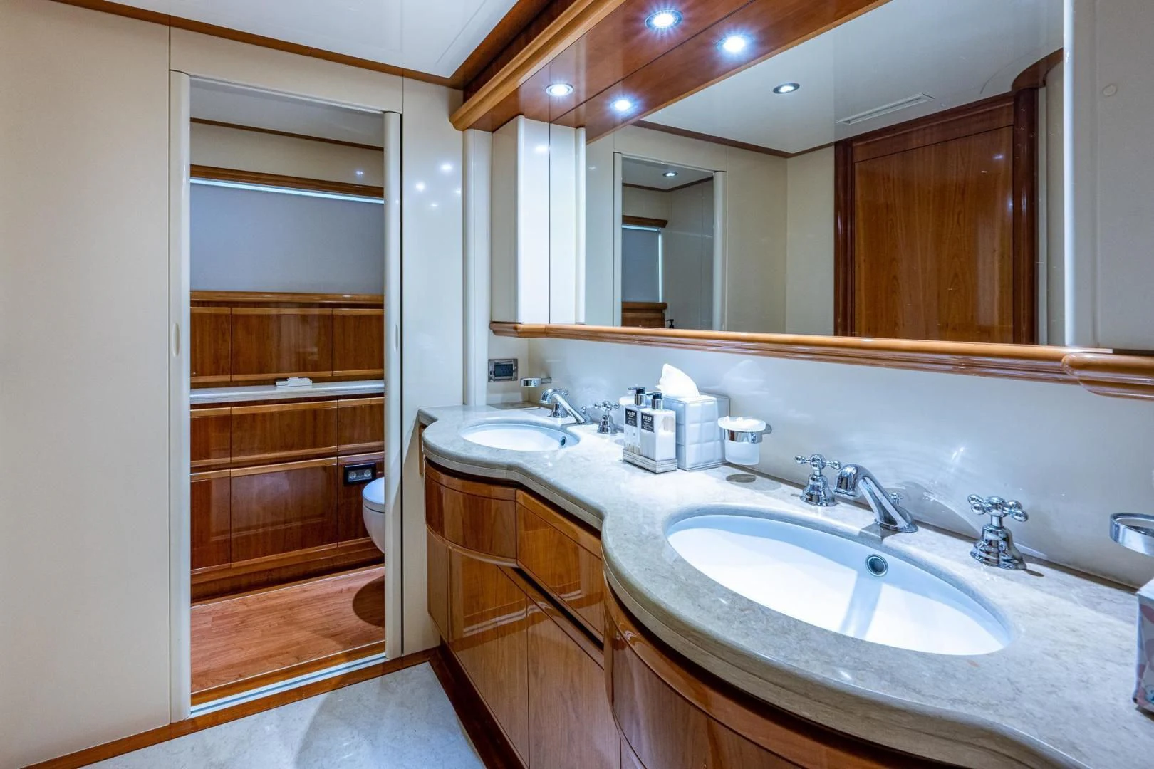 a bathroom with a sink and a mirror aboard EVERYTHING GOOD Yacht for Sale