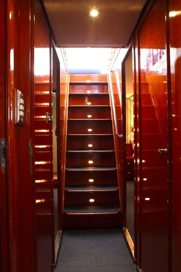 a wooden door with a glass door aboard UNICA Yacht for Sale