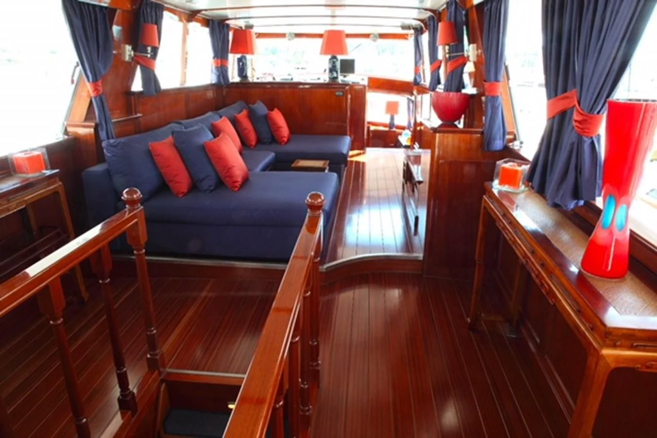 a room with a bed and a table aboard UNICA Yacht for Sale