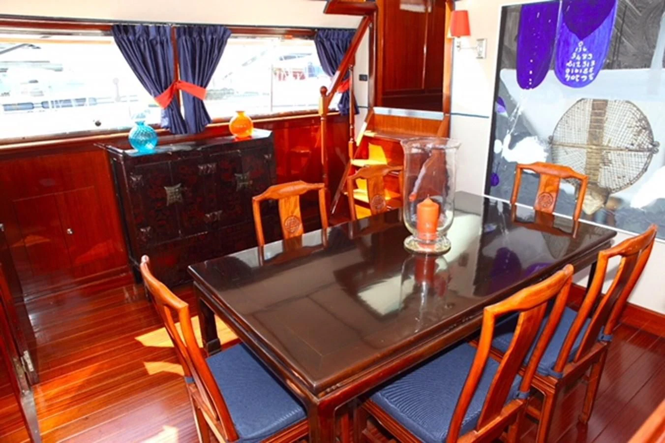 a dining table in a kitchen aboard UNICA Yacht for Sale