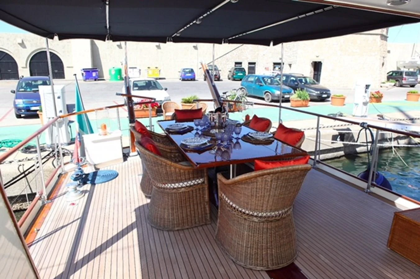 a table with a bowl of food on it aboard UNICA Yacht for Sale