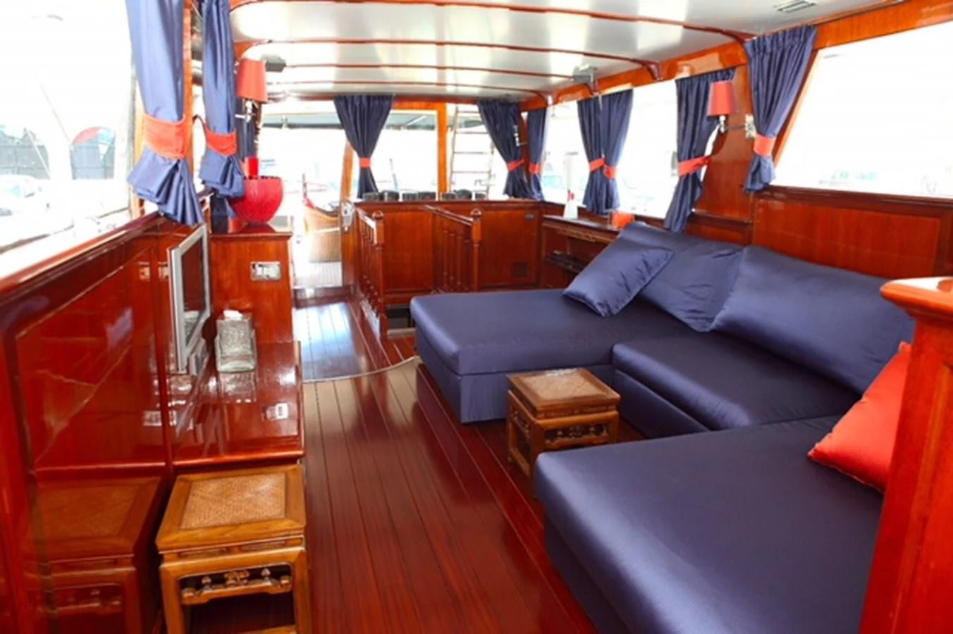 a living room with a couch and a piano aboard UNICA Yacht for Sale