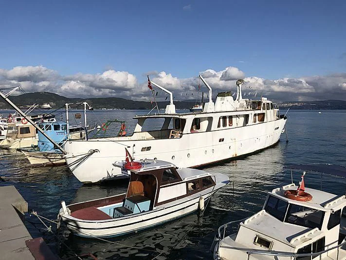 boats docked at a pier aboard SEALION Yacht for Sale