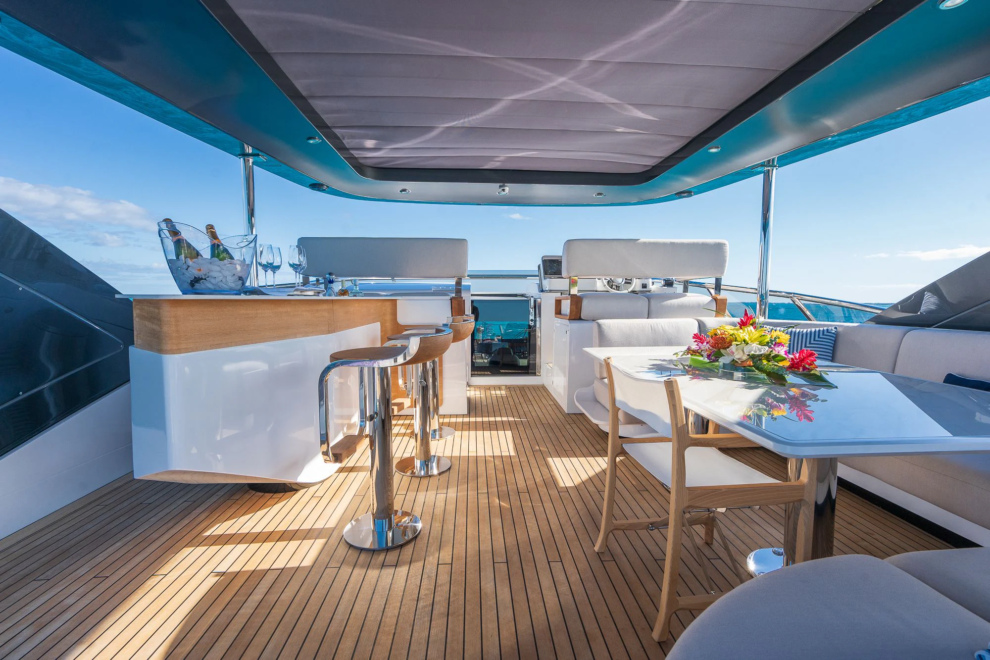 a room with a table and chairs aboard SEA OWL Yacht for Sale