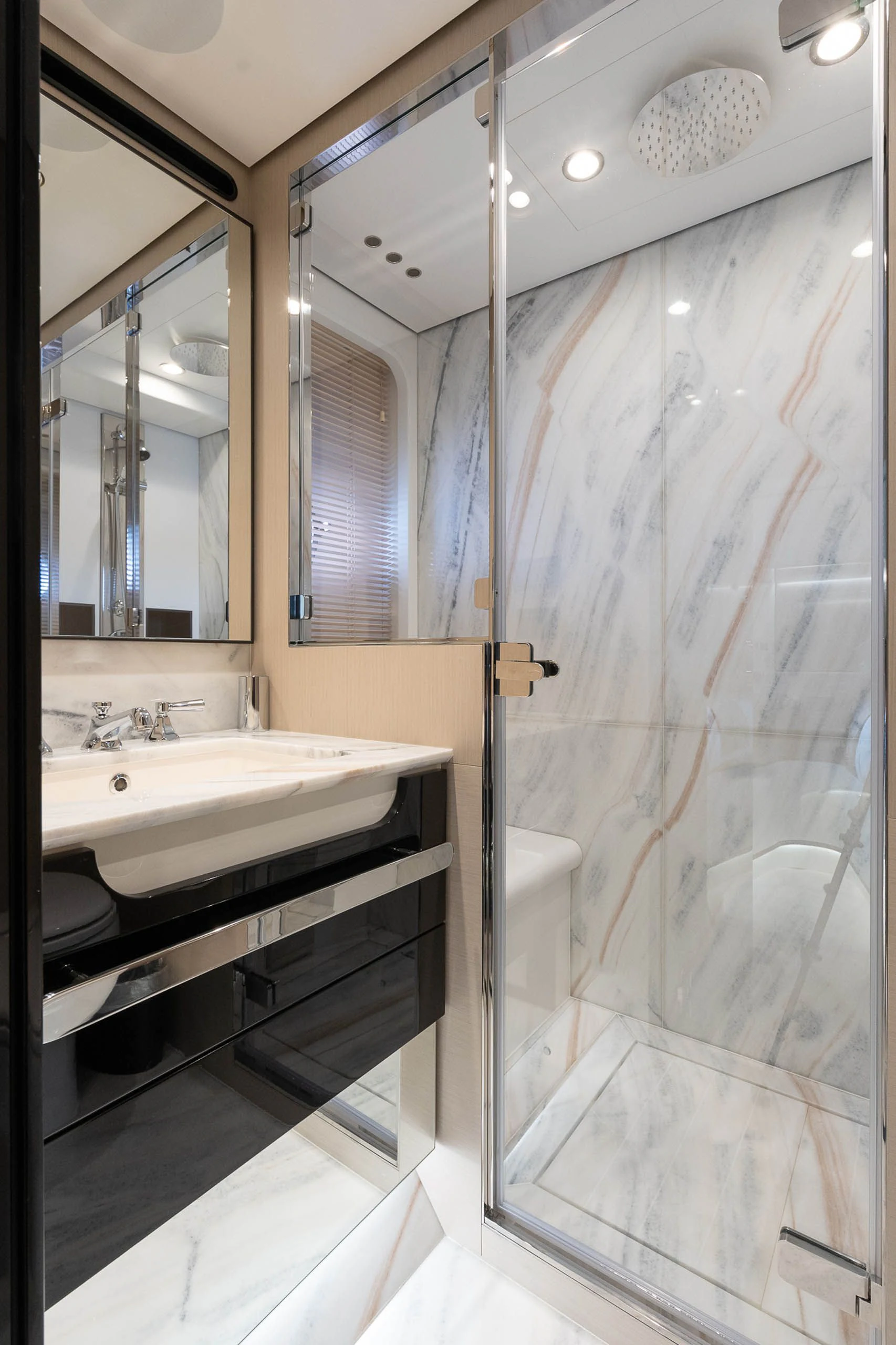 a bathroom with a glass shower aboard SEA OWL Yacht for Sale