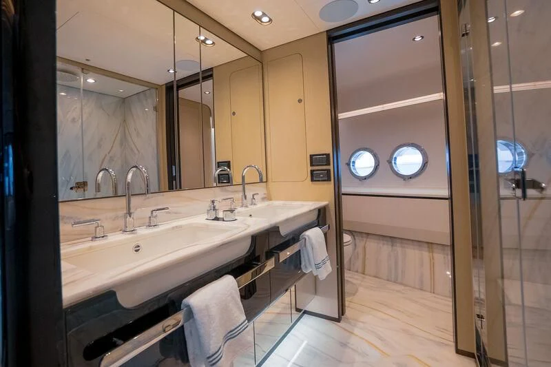 a bathroom with a large mirror aboard SEA OWL Yacht for Sale