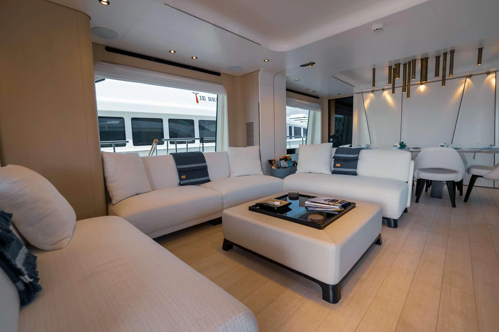 a living room with a couch and a coffee table aboard SEA OWL Yacht for Sale
