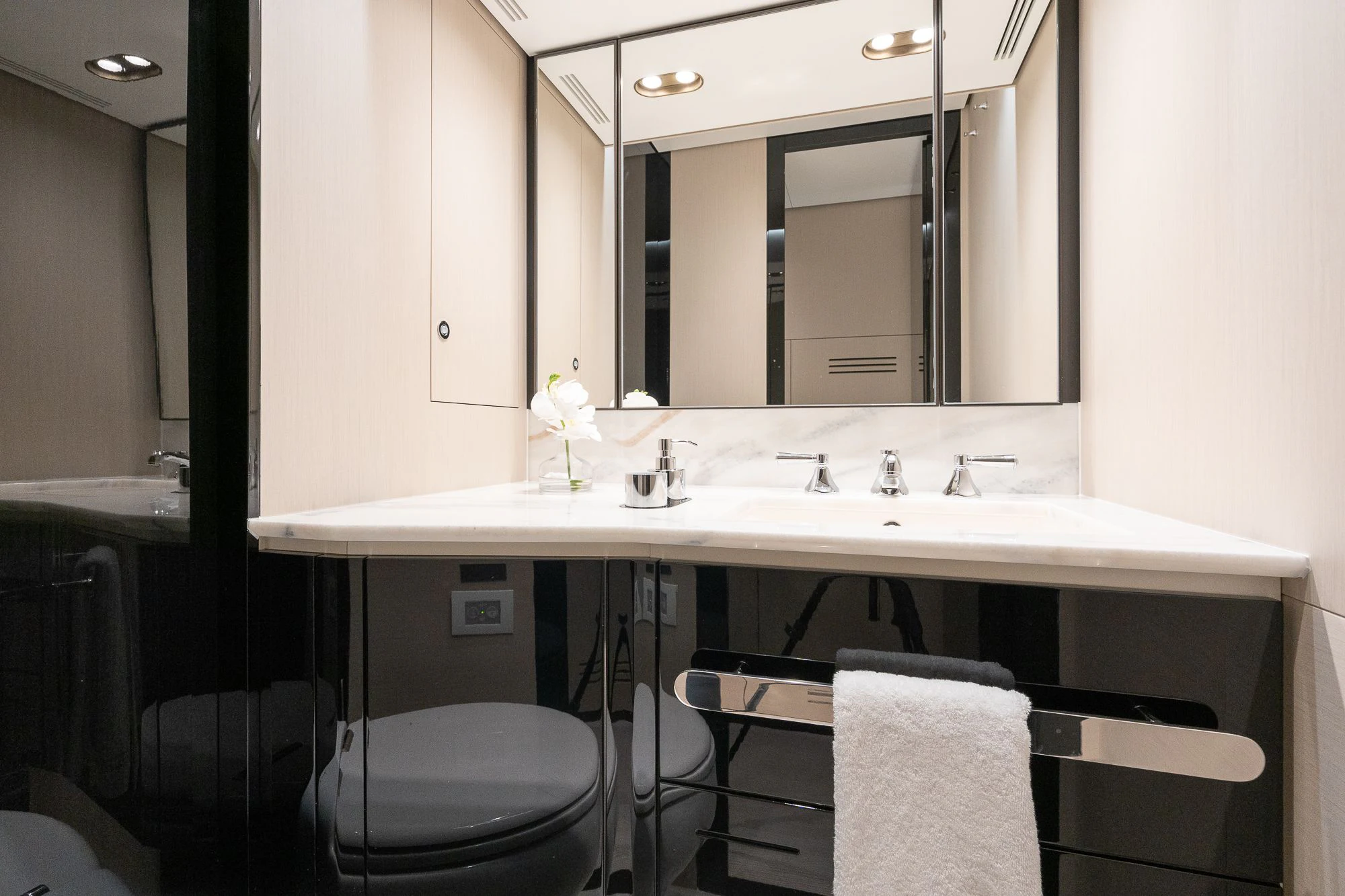 a bathroom with a large mirror aboard SEA OWL Yacht for Sale