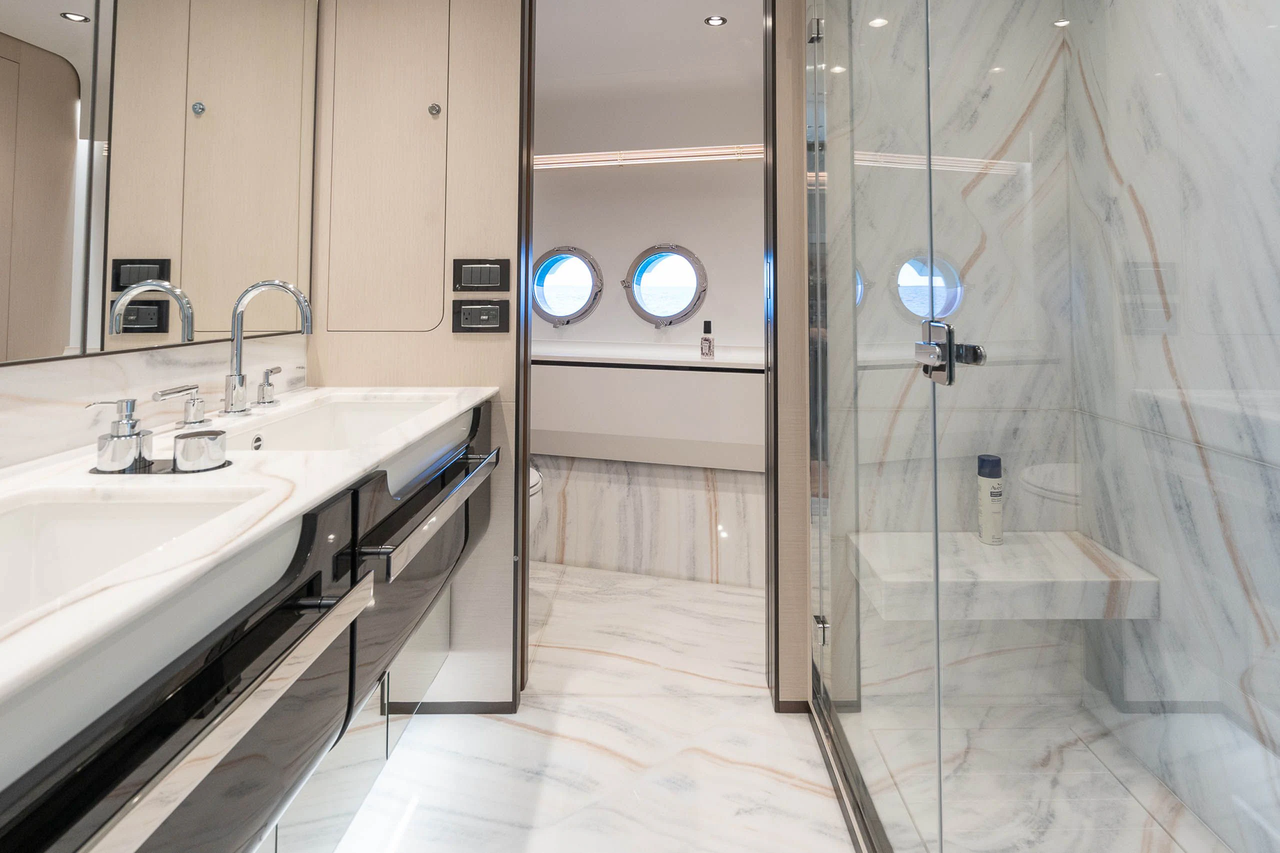 a bathroom with a glass shower aboard SEA OWL Yacht for Sale