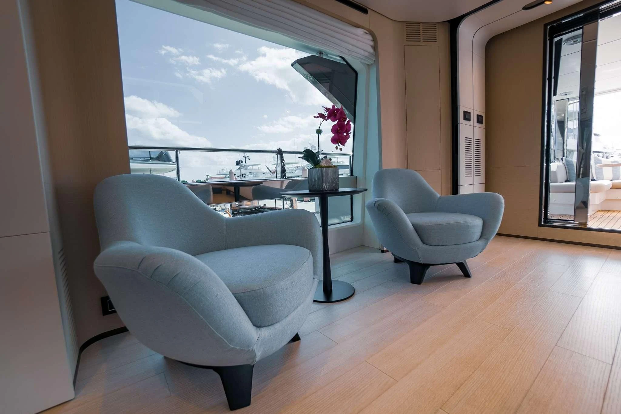 a room with a table chairs and a window aboard SEA OWL Yacht for Sale