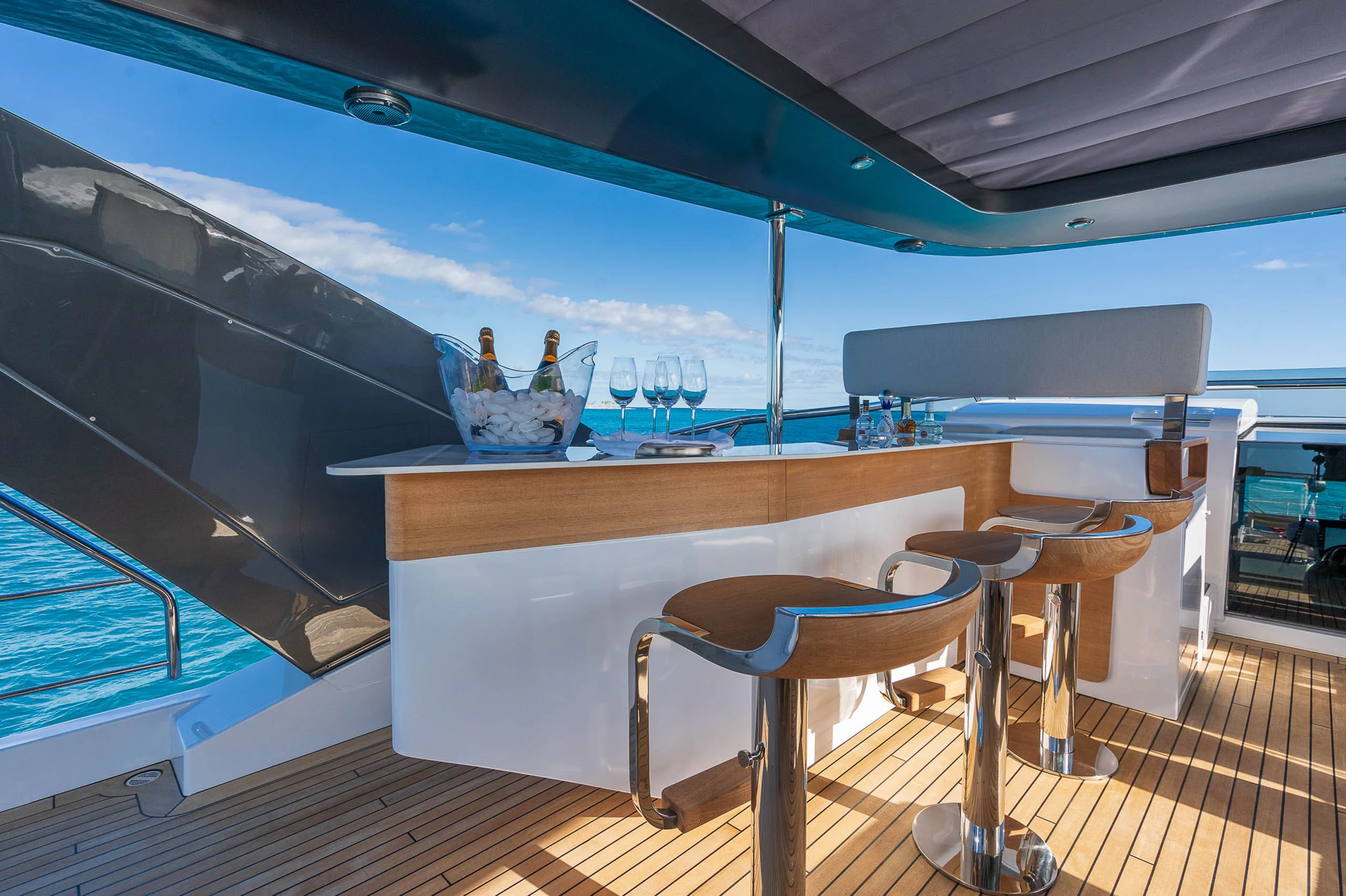 a table with chairs and a window aboard SEA OWL Yacht for Sale