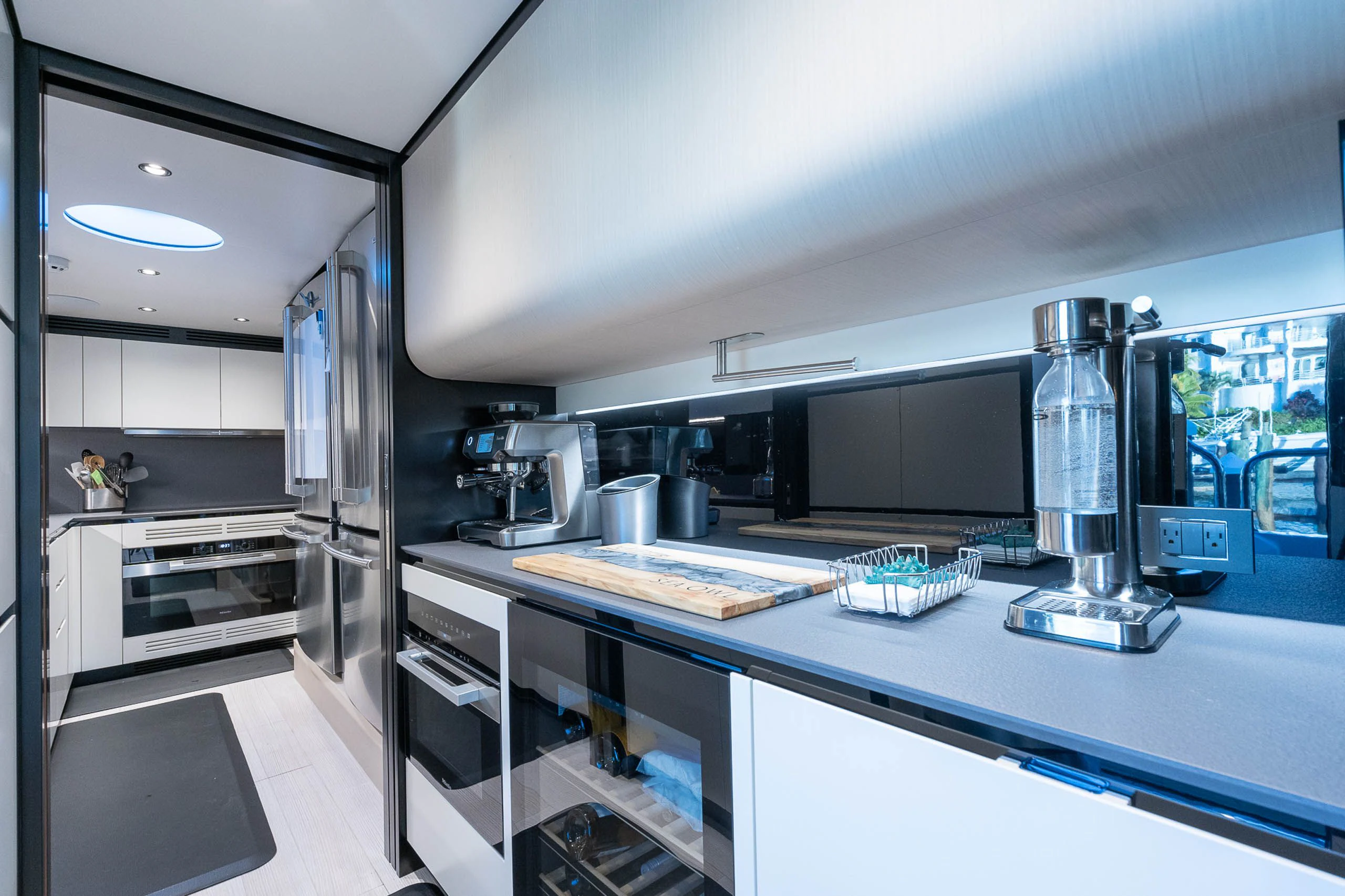 a kitchen with a large glass window aboard SEA OWL Yacht for Sale