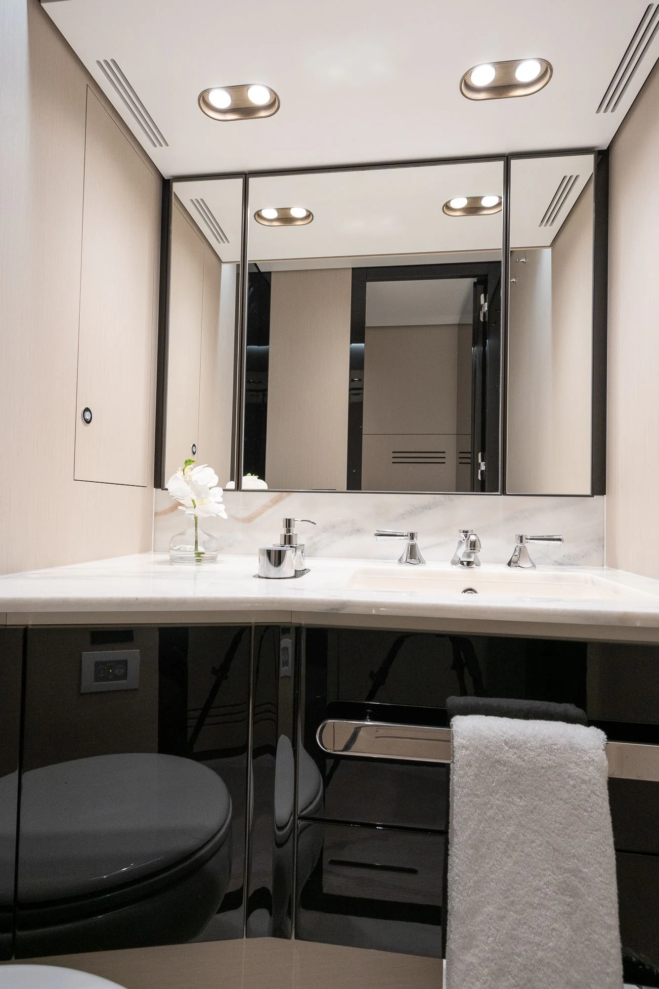 a bathroom with a large mirror aboard SEA OWL Yacht for Sale