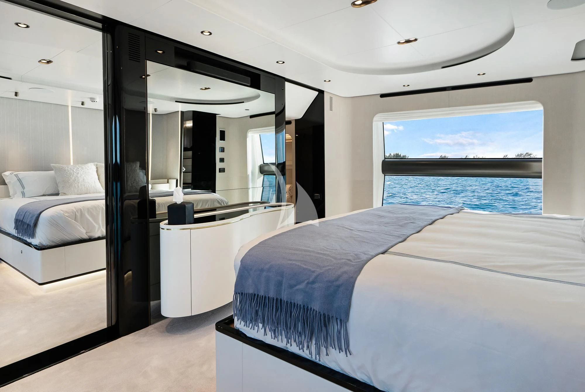 a room with a bed and a large window aboard SEA OWL Yacht for Sale