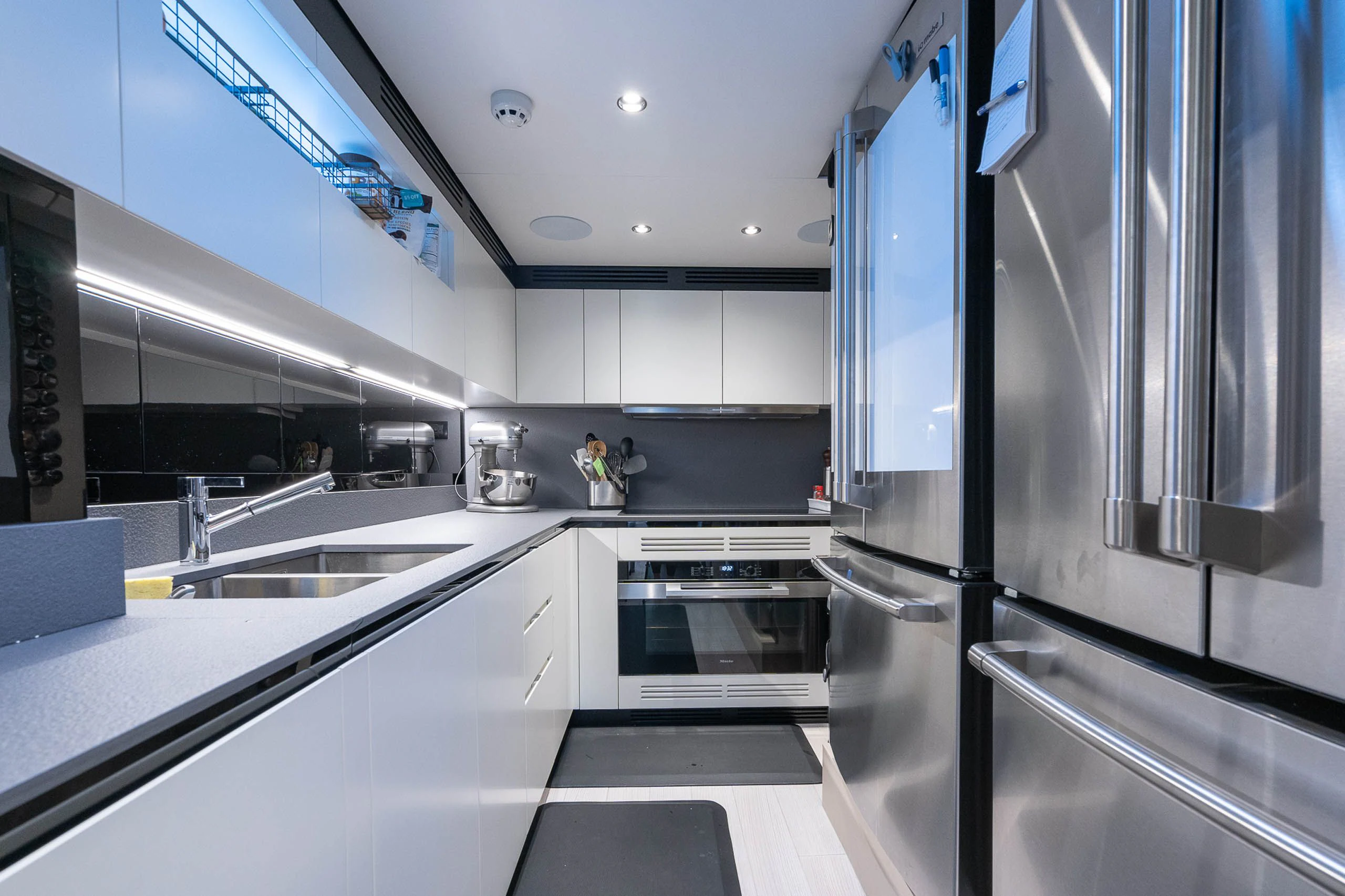 a kitchen with stainless steel appliances aboard SEA OWL Yacht for Sale