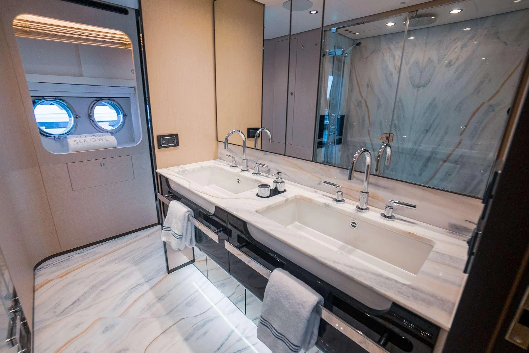 a bathroom with two sinks aboard SEA OWL Yacht for Sale
