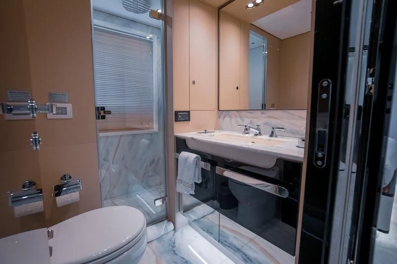 a bathroom with a glass shower aboard SEA OWL Yacht for Sale