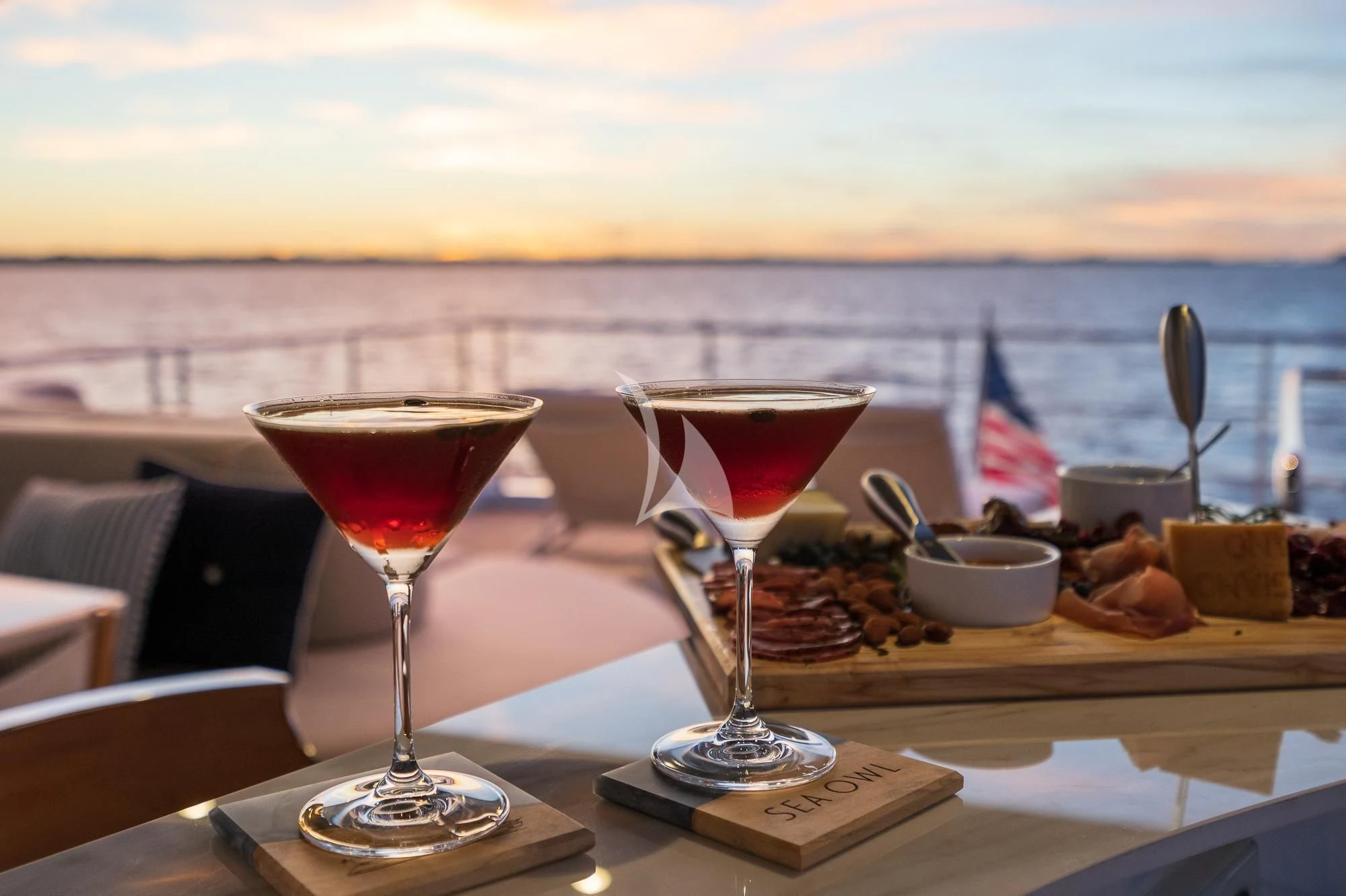 a table with food and drinks on it aboard SEA OWL Yacht for Sale