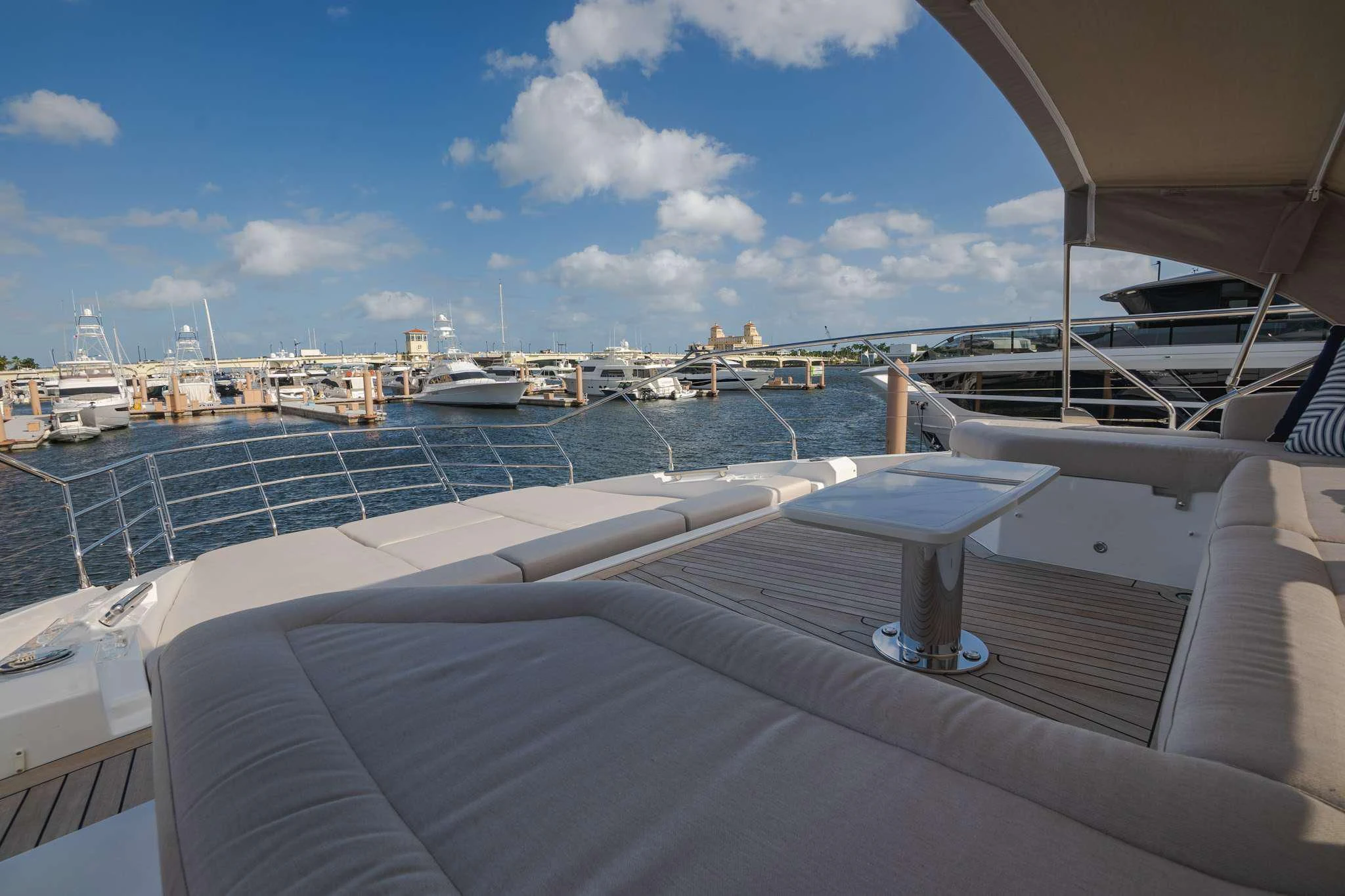 a deck with a view of a marina and boats aboard SEA OWL Yacht for Sale