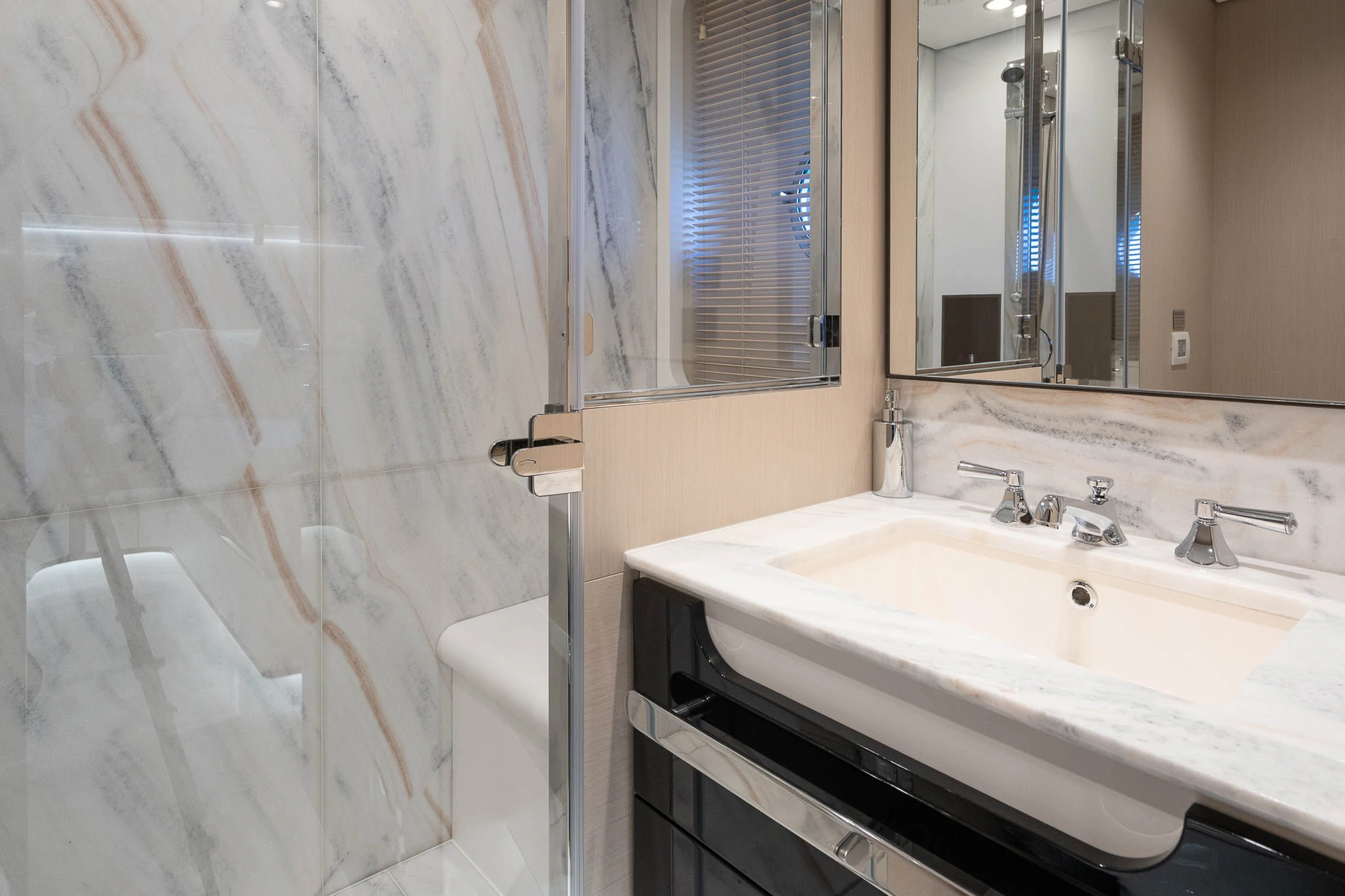 a bathroom with a sink and a mirror aboard SEA OWL Yacht for Sale