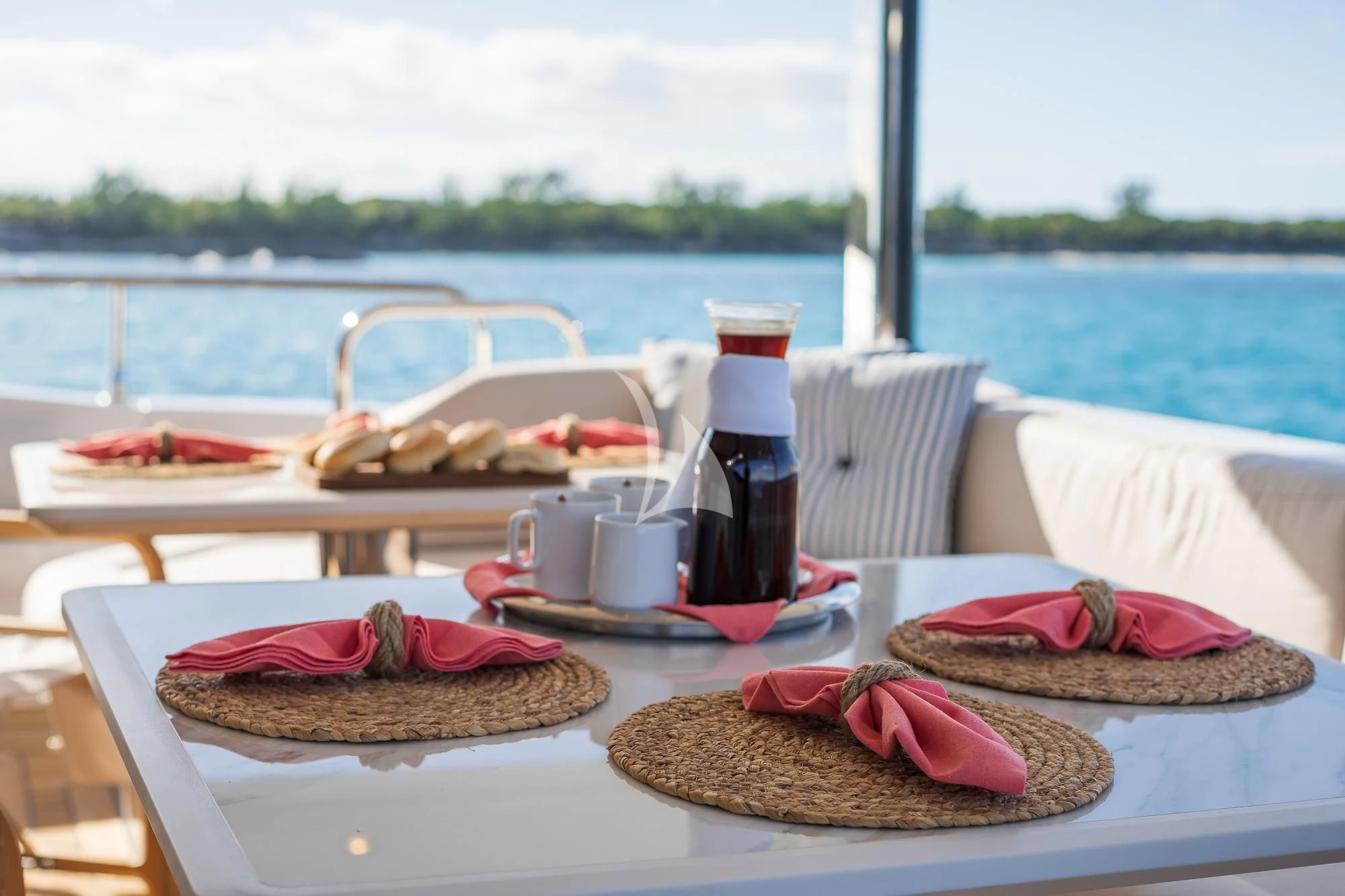a table with food and drinks on it aboard SEA OWL Yacht for Sale