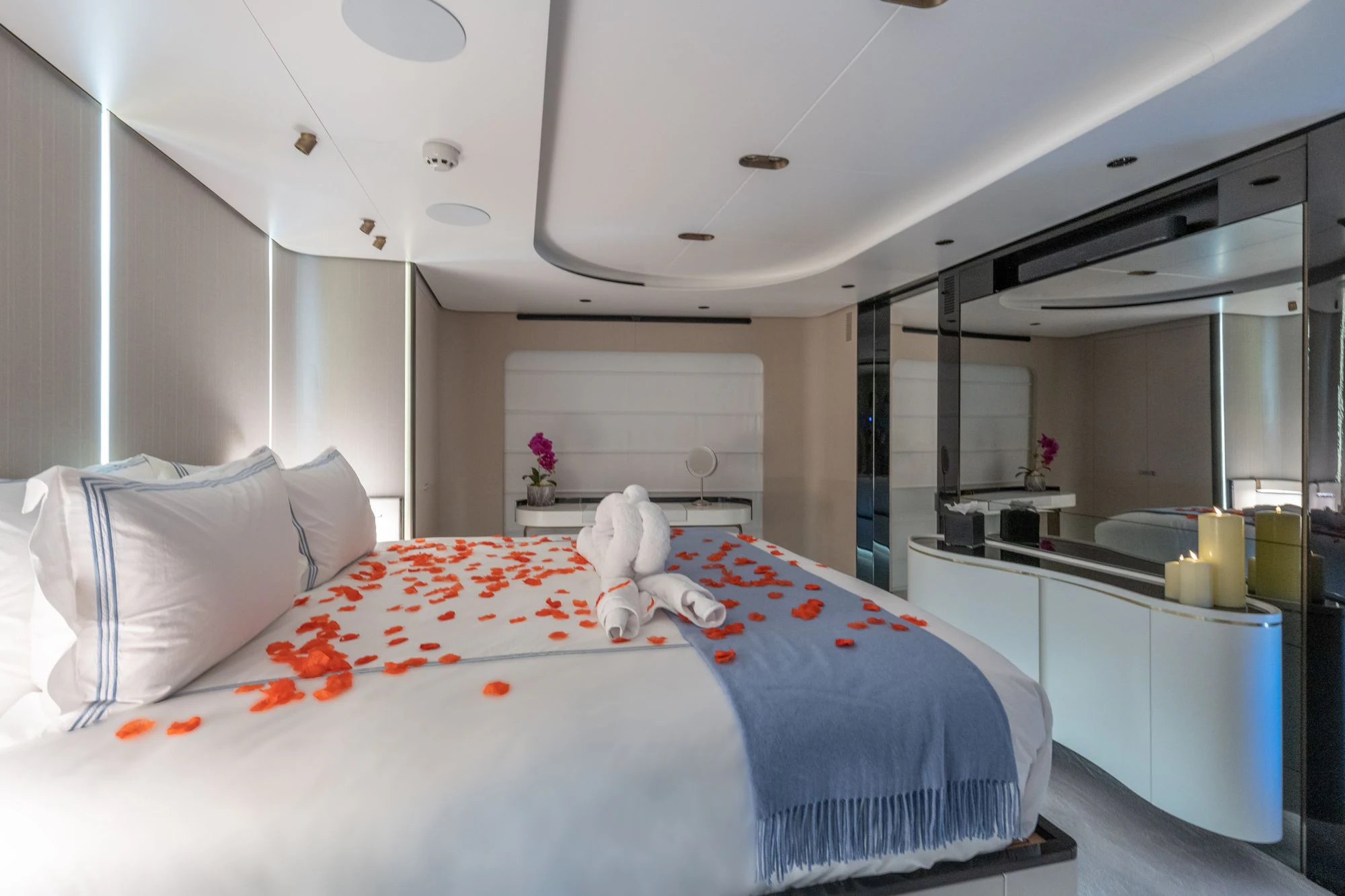 a bed with a white sheet and pillows aboard SEA OWL Yacht for Sale