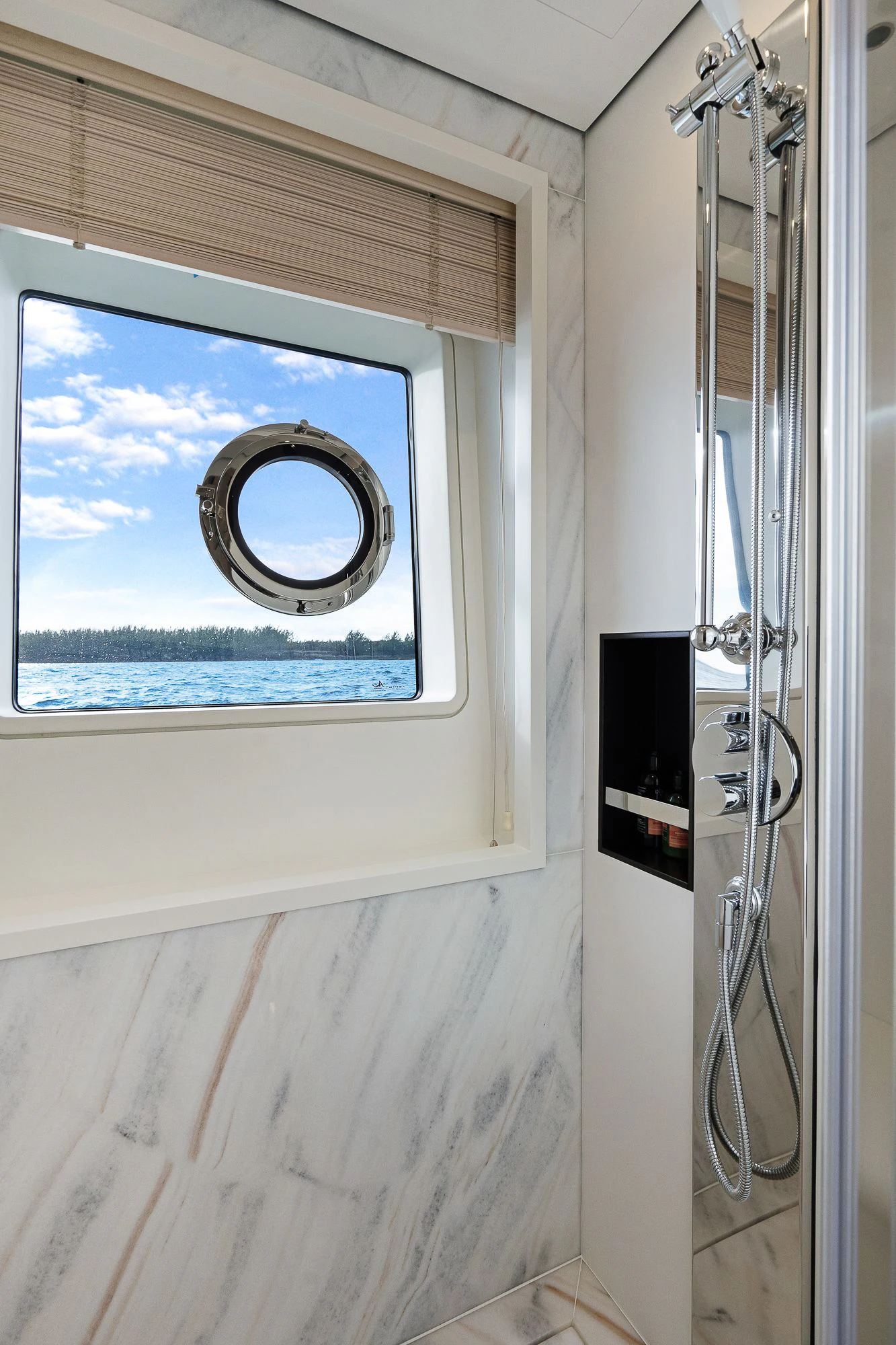 a window with a view of the ocean aboard SEA OWL Yacht for Sale