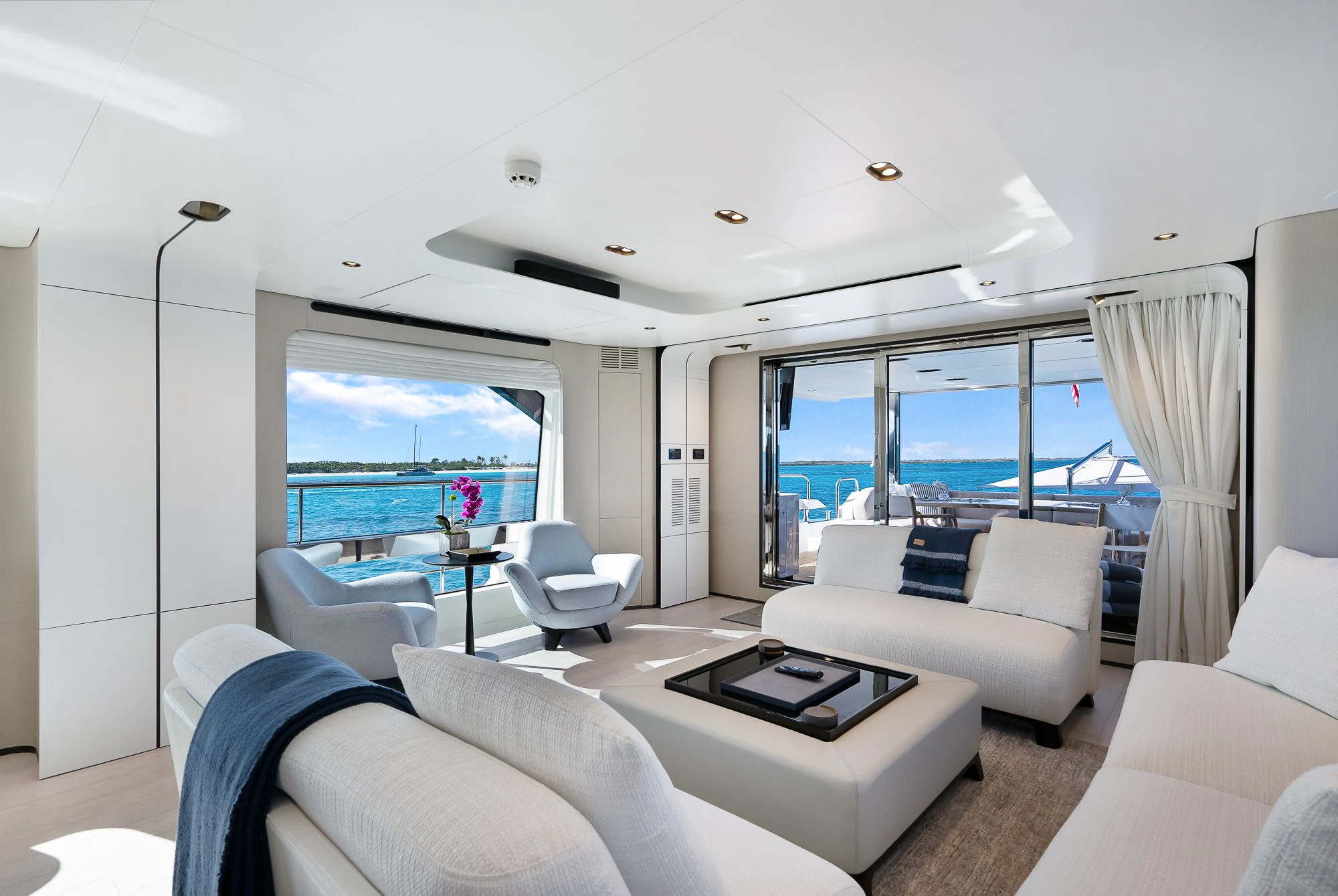 a living room with a large window aboard SEA OWL Yacht for Sale