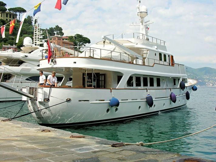 a white boat with people on it aboard MIZAR Yacht for Sale