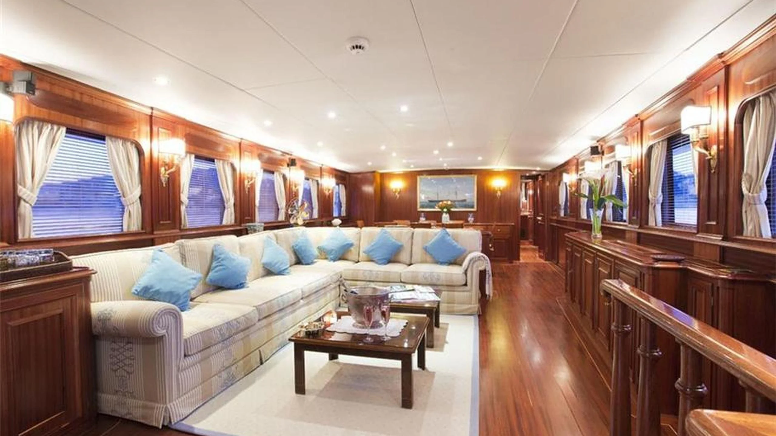 a living room with a couch and a table aboard MIZAR Yacht for Sale