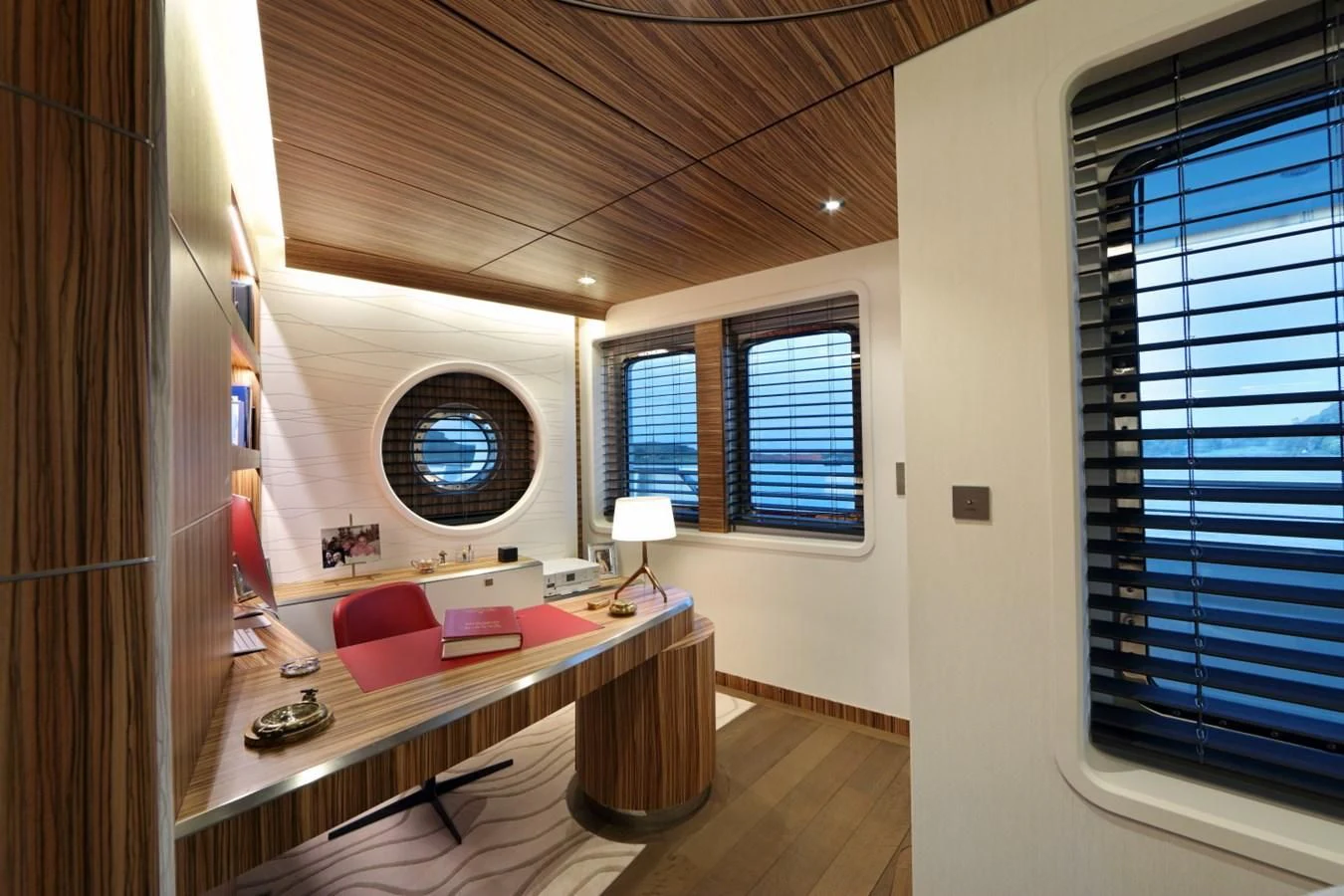 a room with a desk and a window aboard YERSIN Yacht for Charter