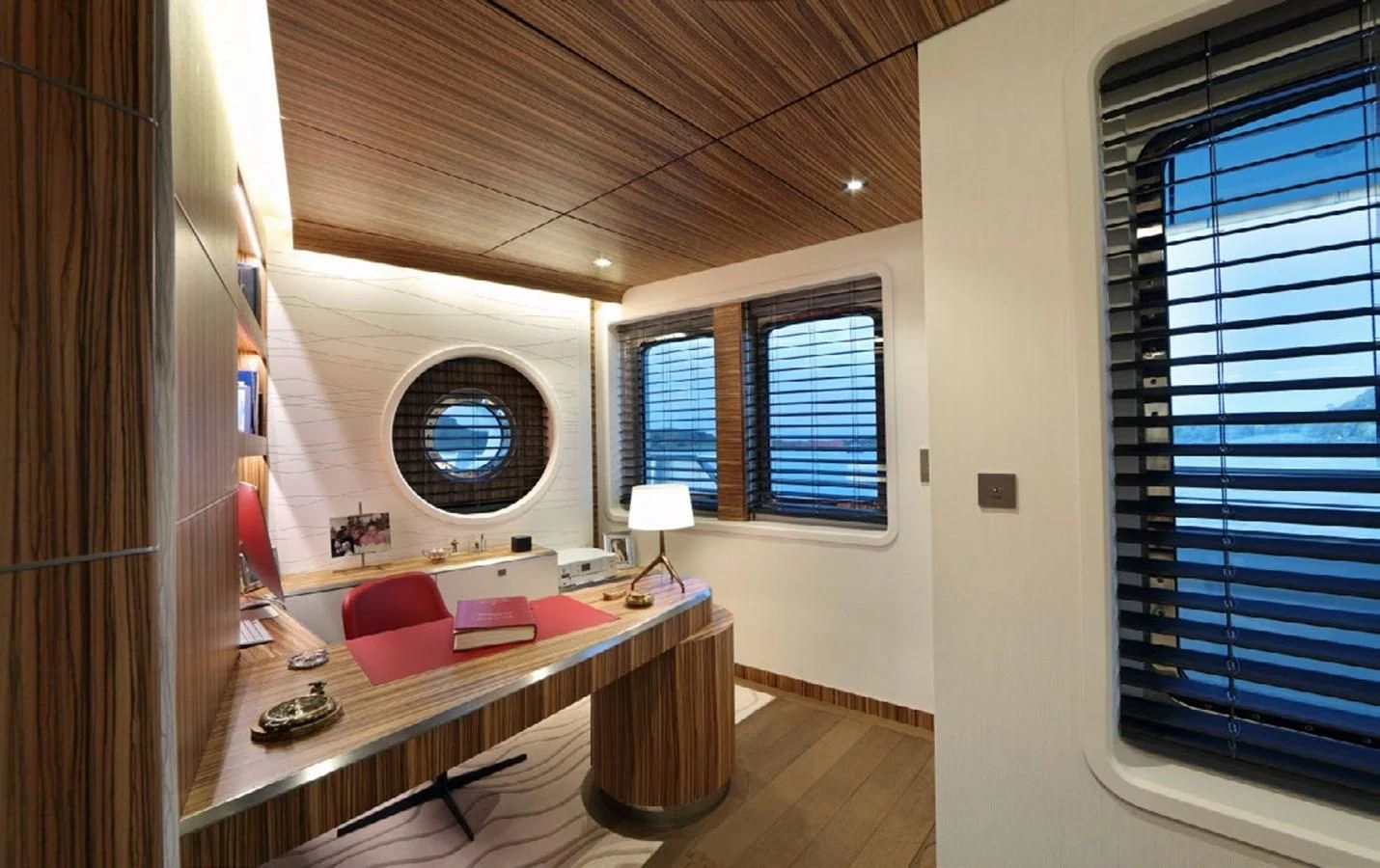 a room with a bed and a desk aboard YERSIN Yacht for Charter