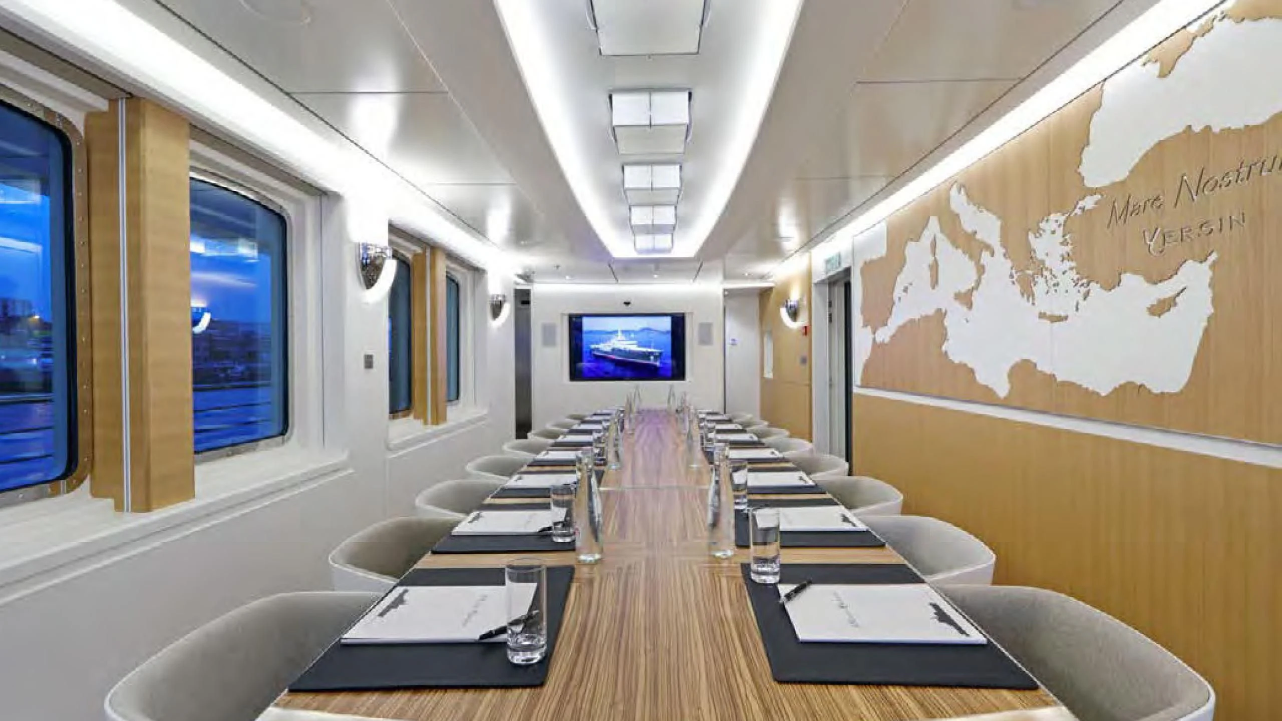 a room with chairs and tables aboard YERSIN Yacht for Charter