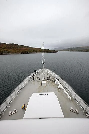 a group of people on a dock by a body of water aboard YERSIN Yacht for Charter