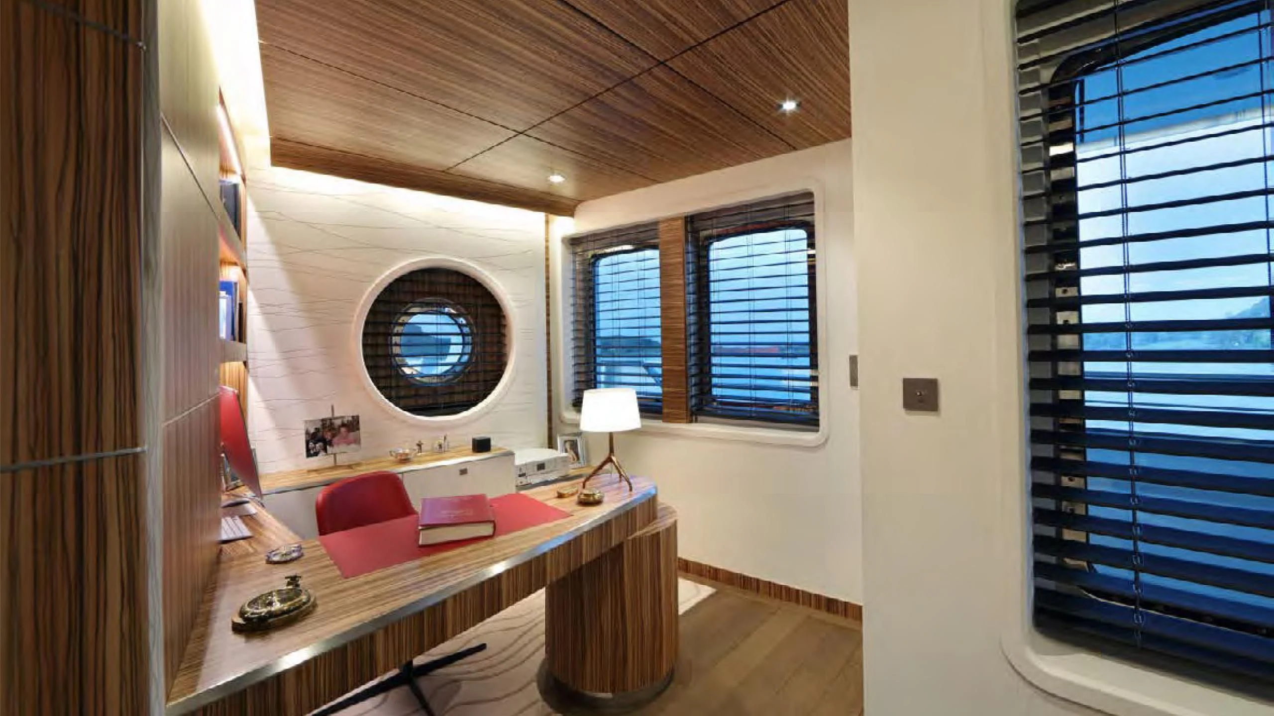 a room with a bed and a desk aboard YERSIN Yacht for Charter