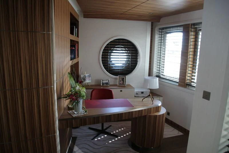 a room with a table and a bench aboard YERSIN Yacht for Charter