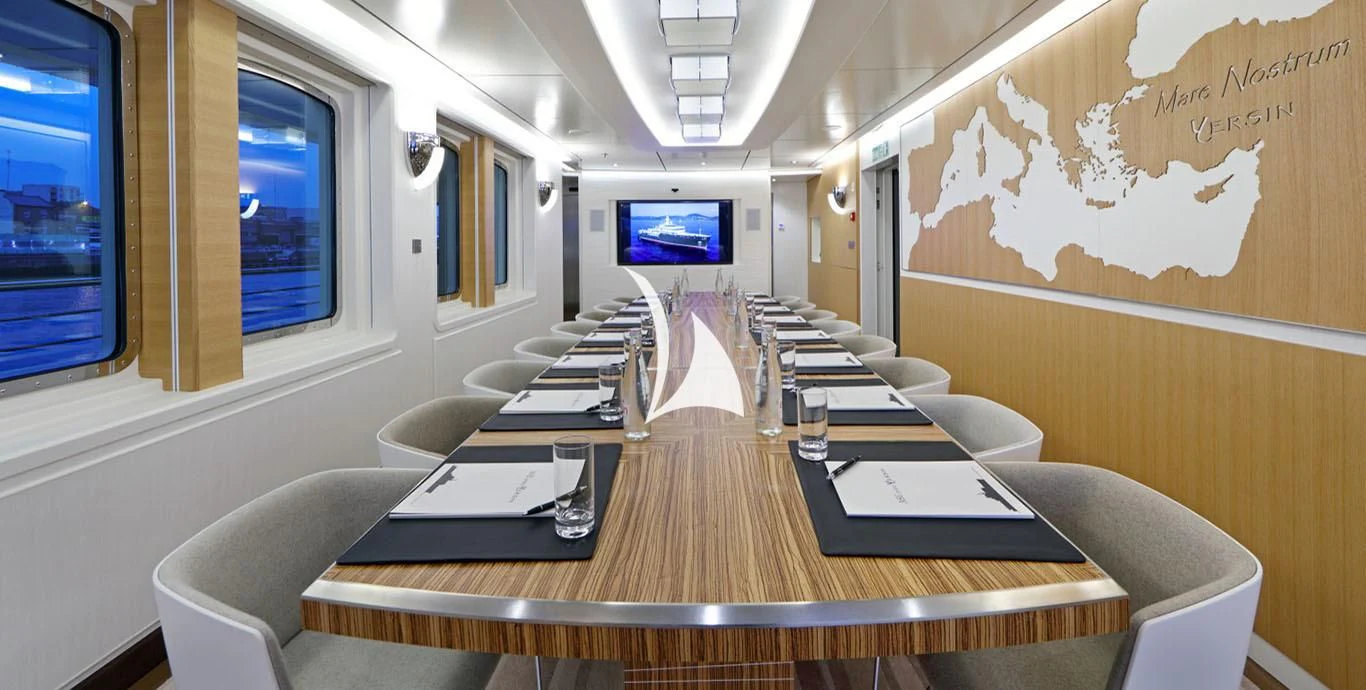 a conference room with a table and chairs aboard YERSIN Yacht for Charter