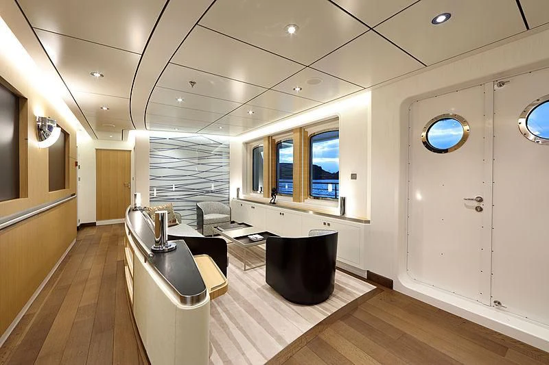 a room with a table and chairs aboard YERSIN Yacht for Charter