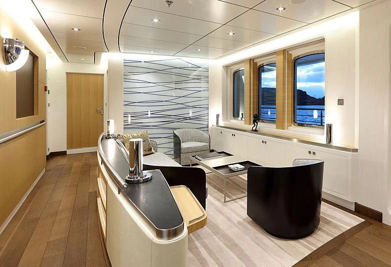 a living room with a large window aboard YERSIN Yacht for Charter