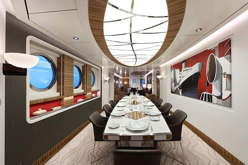 a room with a table and chairs aboard YERSIN Yacht for Charter