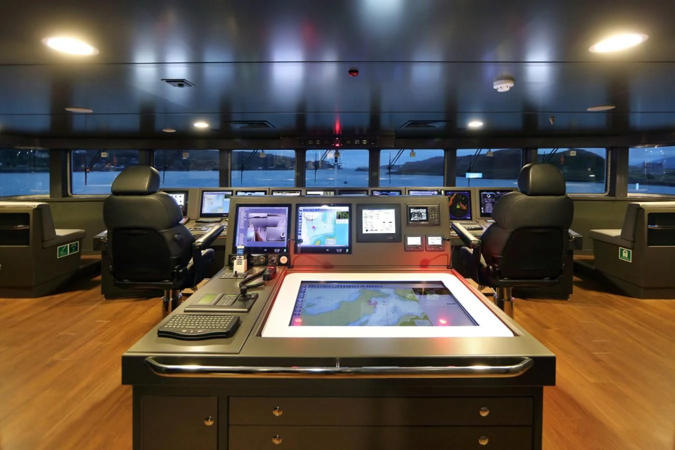a room with a table and chairs aboard YERSIN Yacht for Charter