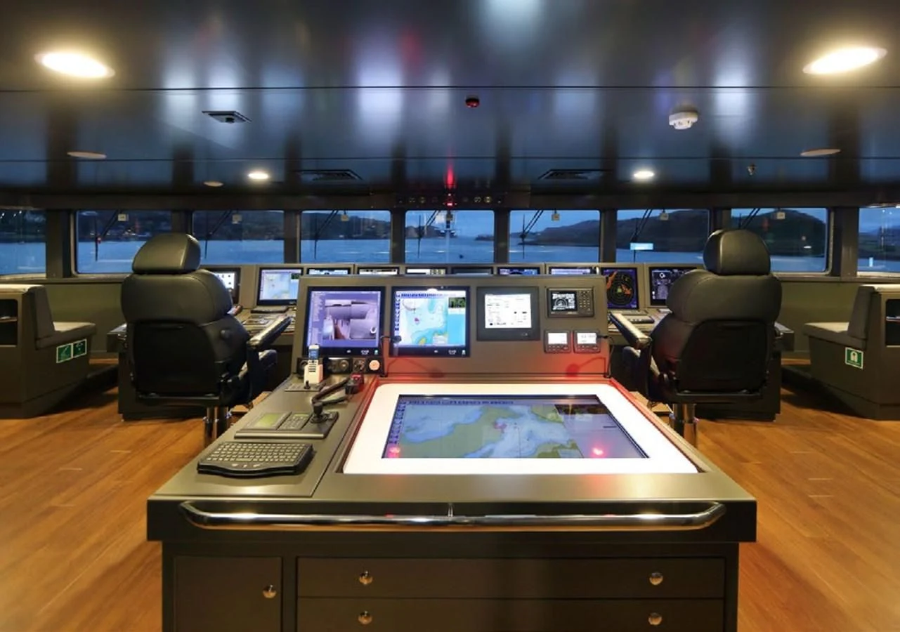 a room with a table with computers aboard YERSIN Yacht for Charter