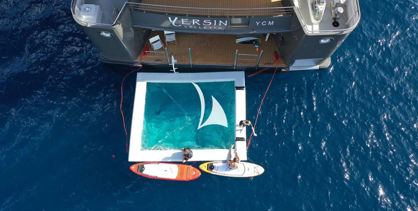 a space ship with a satellite in the background aboard YERSIN Yacht for Charter