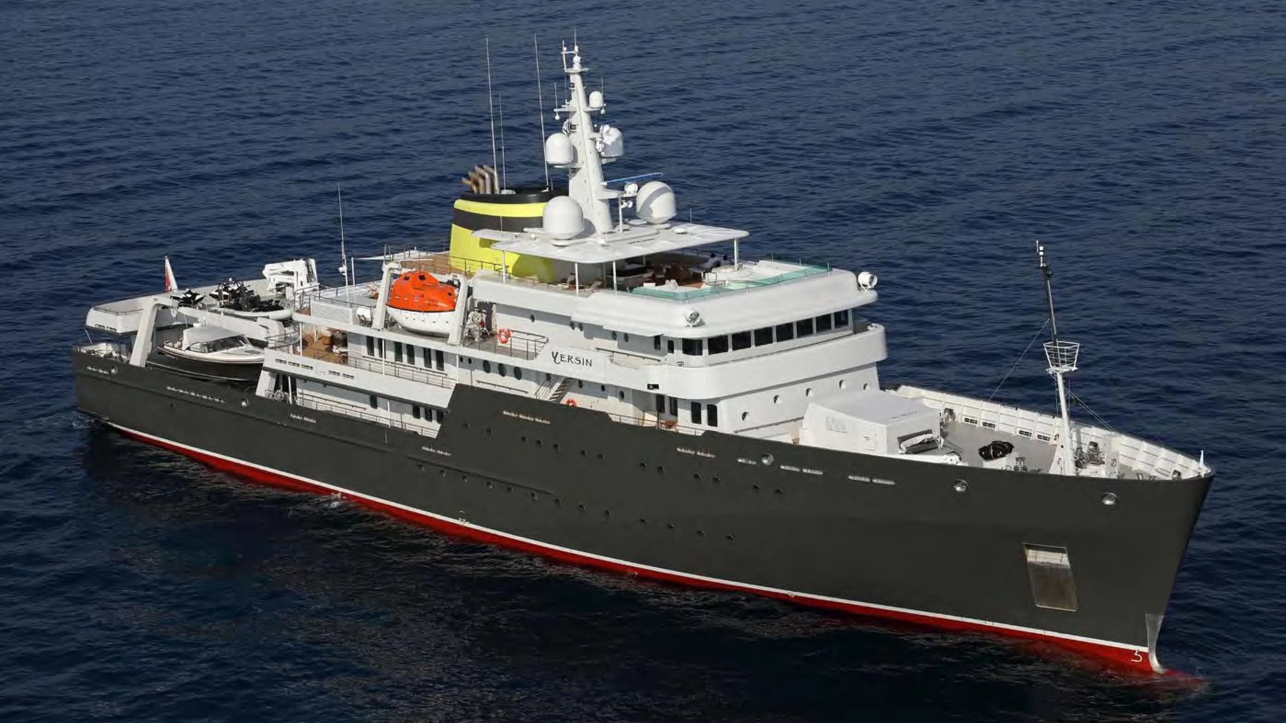 a large white and red ship aboard YERSIN Yacht for Charter