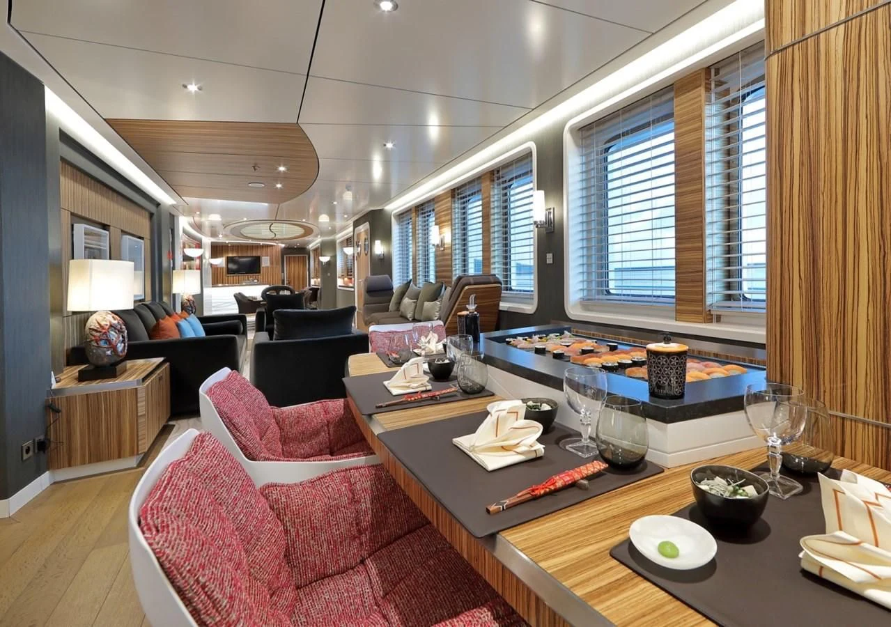 a living room with a table and chairs aboard YERSIN Yacht for Charter