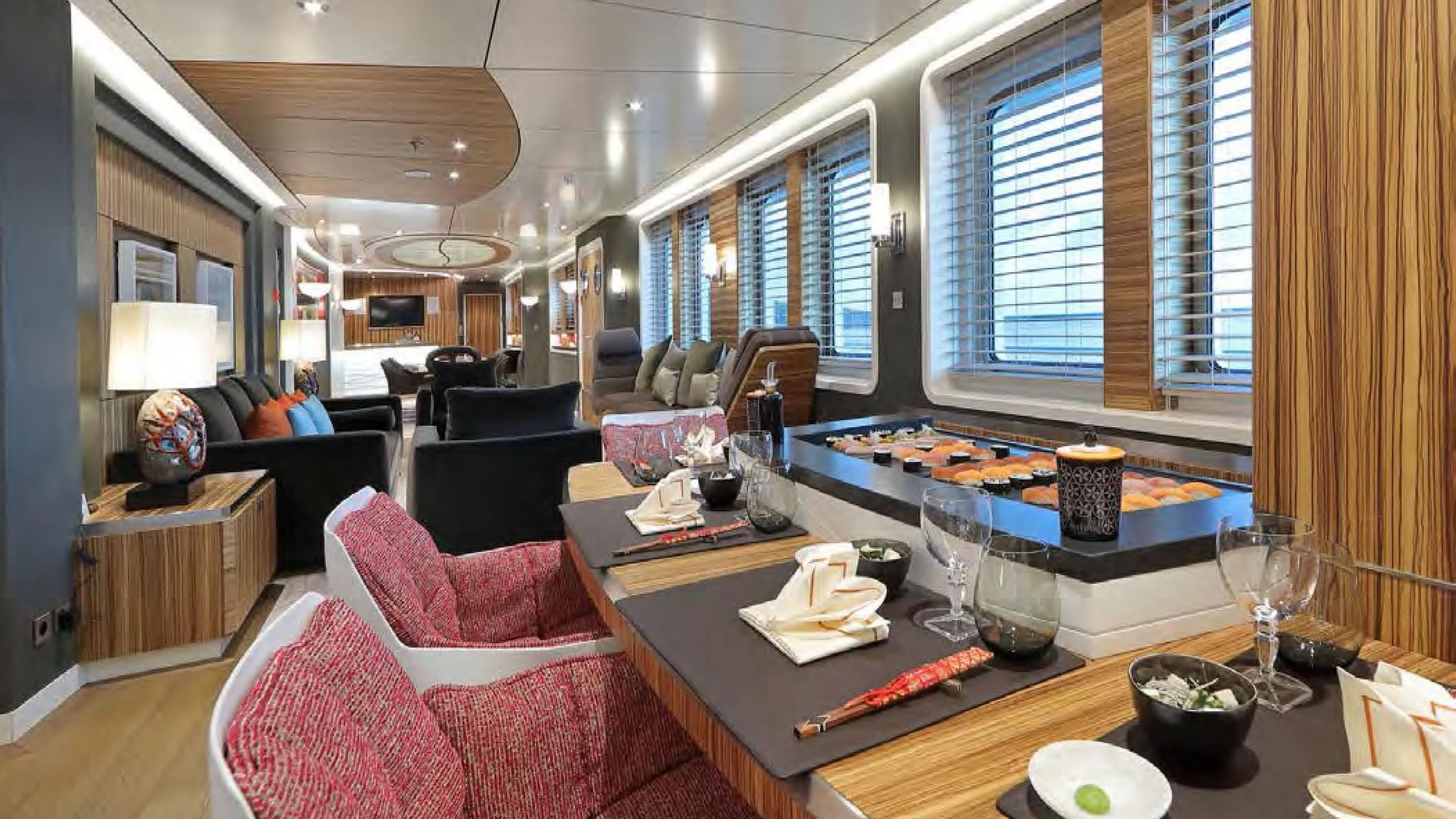 a large living room with a large table and chairs aboard YERSIN Yacht for Charter