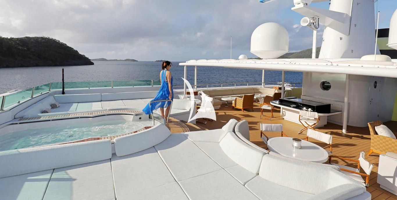 a person standing on a deck of a boat aboard YERSIN Yacht for Charter