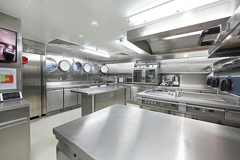 a large kitchen with stainless steel appliances aboard YERSIN Yacht for Charter