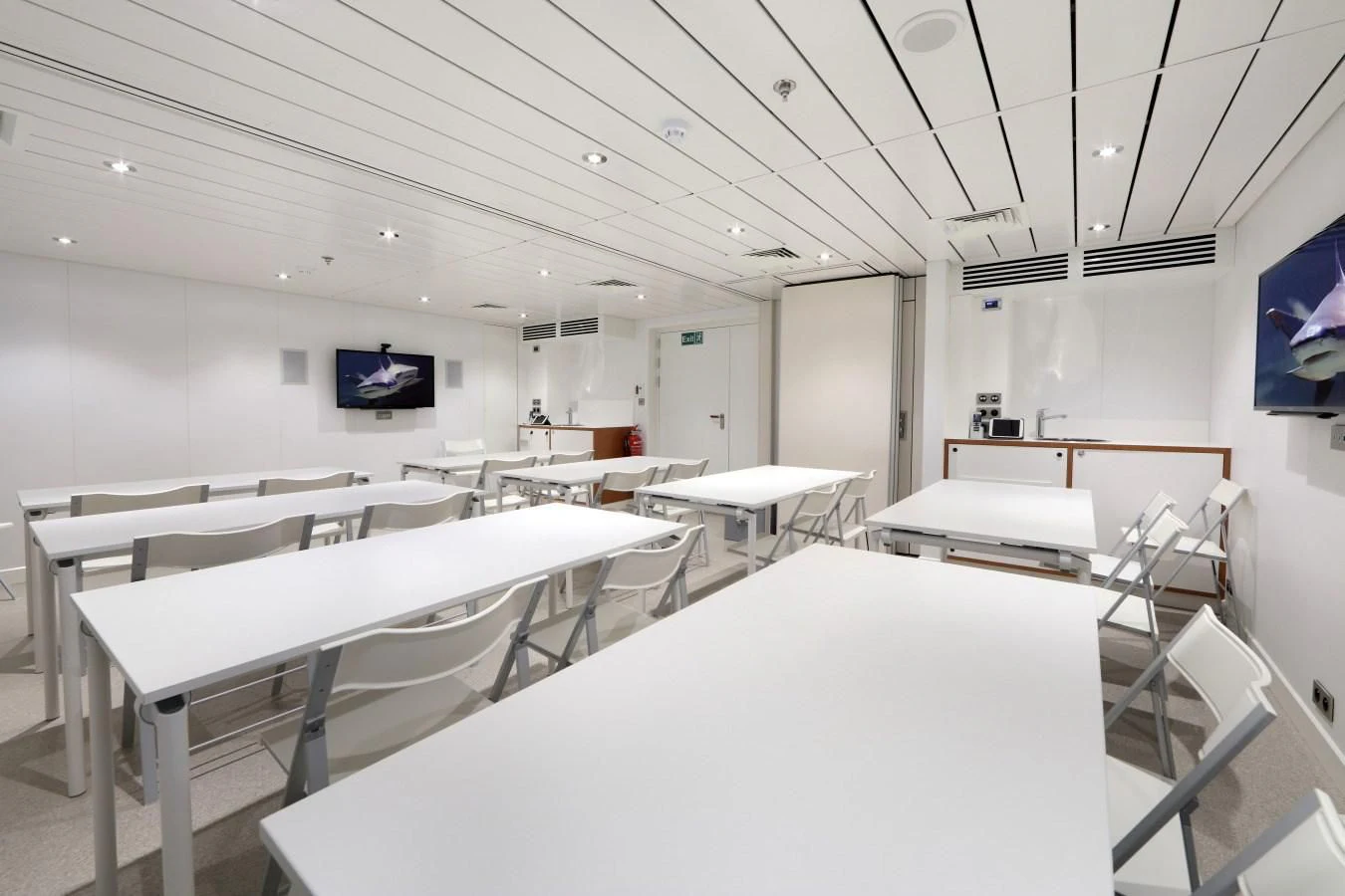 a room with tables and chairs aboard YERSIN Yacht for Charter