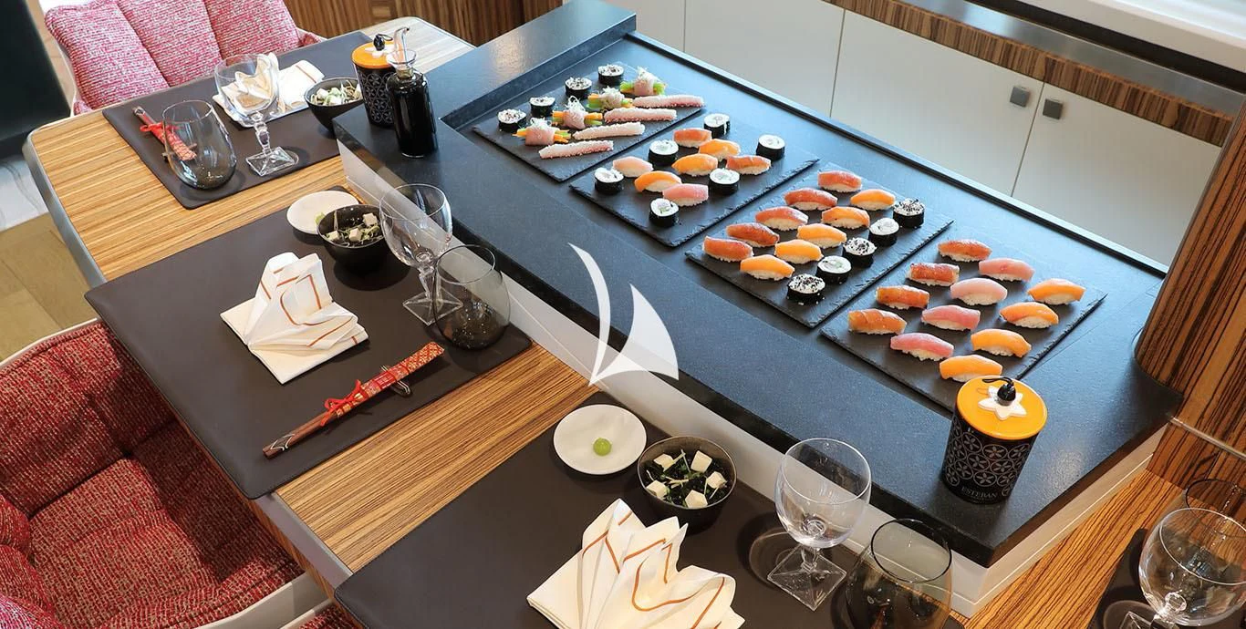 a table with plates and glasses aboard YERSIN Yacht for Charter